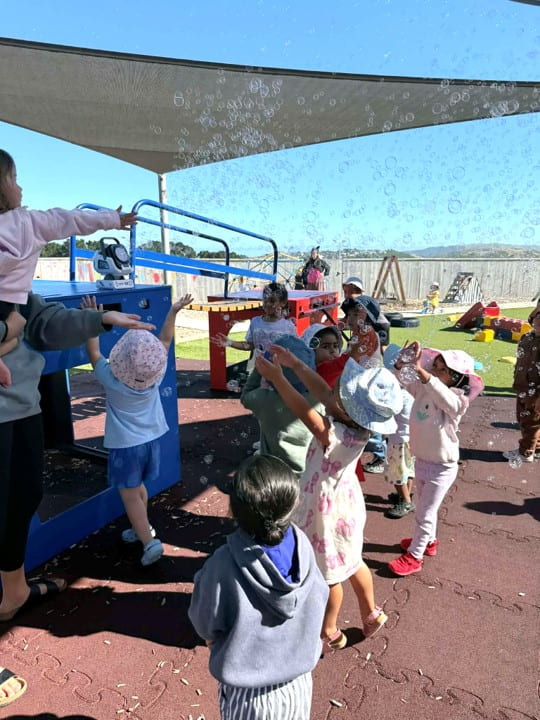 Aotea porirua children chasing bubbles outdoor play